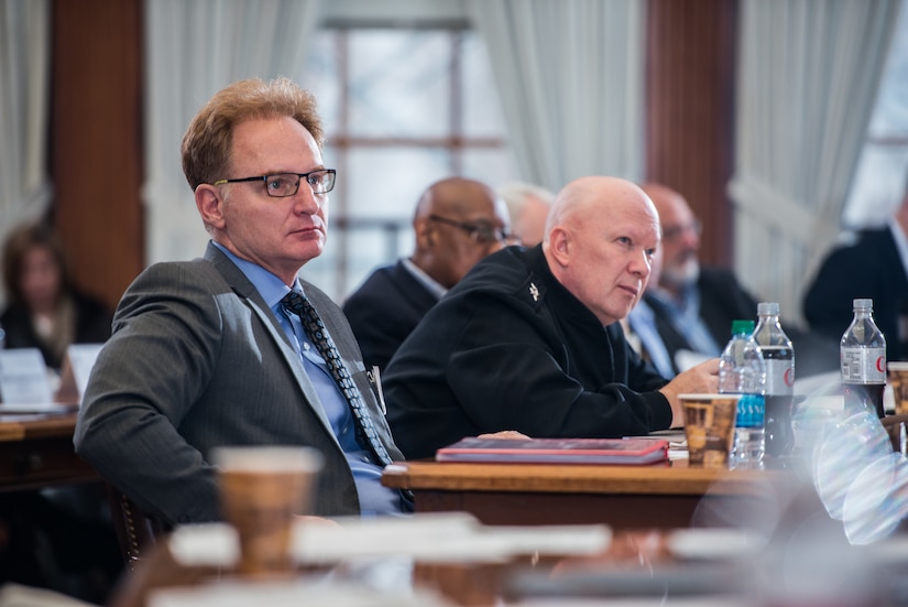 Thomas B. Modly, undersecretary of the Navy, and Rear Adm. Jeffrey A. Harley, Naval War College president, listen to a presenter at the "Breaking the Mold; A Workshop on War and Strategy in the 21st Century," held in Newport, R.I.