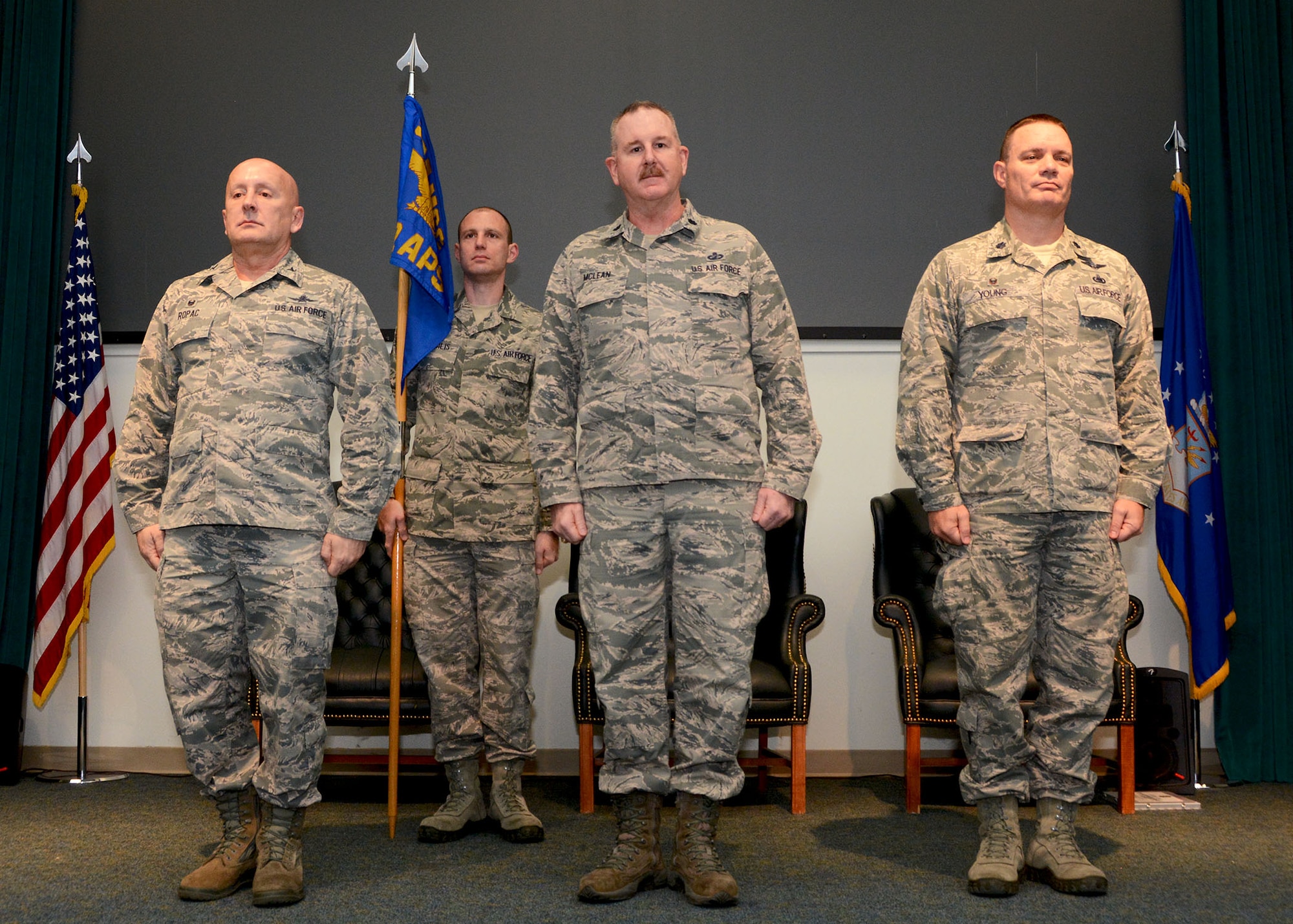 Lt. Col. Darryl McLean, center, stands before the 72nd Aerial Port Squadron after being named their new commander Feb. 10, 2019, Tinker Air Force Base, Oklahoma. Col. Richard Ropac, left, 507th Mission Support Group commander, transferred the guidon to McLean from Lt. Col. William Young, right, after Young served as 72nd APS for nine years. (U.S. Air Force photo by Tech. Sgt. Samantha Mathison)