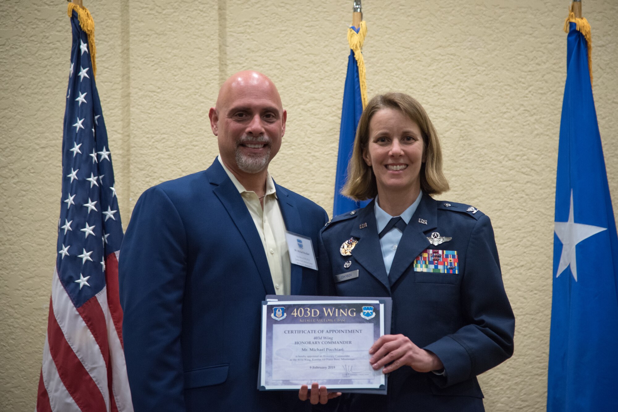 Col. Jennie Johnson, 403rd Wing commander poses with Mr. Michael Pocchiari, Garden Park Medical Center Vice President of Human Resources HCA during his induction into the Honorary Commanders program during a ceremony at Keesler Air Force Base, Mississippi February 9, 2019.  The Honorary Commanders program was developed to enhance relationships between the local civilian community and the 403rd wing. (U.S. Air Force photo by Staff Sgt. Shelton Sherrill)