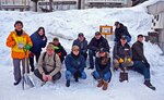 Blue Ridge and 7th Fleet snow lantern event volunteers pose for a group photo with the event coordinators in Otaru, Japan.
