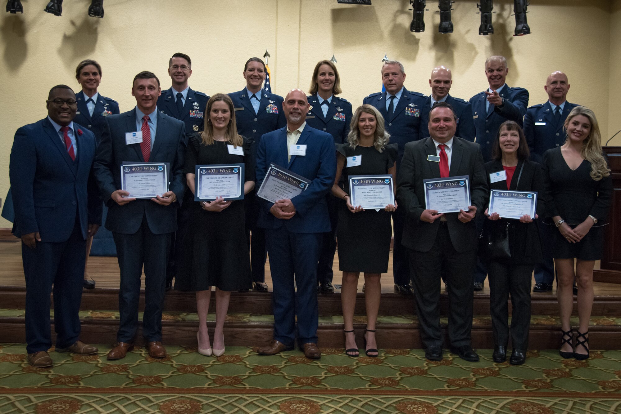 The 403rd Wing leadership poses with the local community leaders after their induction into the Honarary Commanders program during a ceremony at Keesler Air Force Base, Mississippi February 9, 2019.  The Honorary Commanders program was developed to enhance relationships between the local civilian community and the 403rd wing. (U.S. Air Force photo by Staff Sgt. Shelton Sherrill)