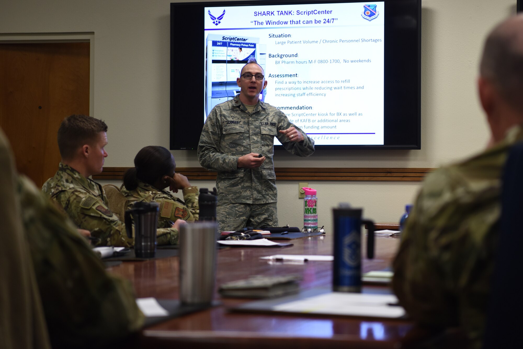 U.S. Air Force Maj. Travis Schmitt, 377th Medical Support Squadron Pharmacy Flight commander, pitches an idea to a panel at the “Tiger Tank” innovation competition at Kirtland Air Force Base, N.M., Feb. 11, 2019. The panel consisted of judges from different organizations across the 377th Air Base Wing, and was led by the wing commander and command chief. (U.S. Air Force photo by Senior Airman Eli Chevalier)