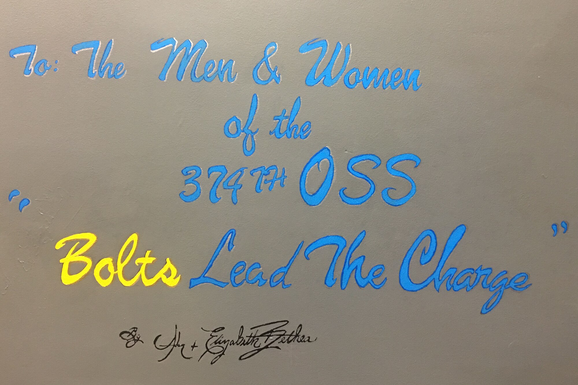 Artwork signed by Tech Sgt. Adam Bethea, 374th OSS aircrew flight equipment craftsman and his wife Elizabeth Bethea, is finished in the 374 OSS conference room at Yokota Air Base, Japan, Aug. 18, 2018.