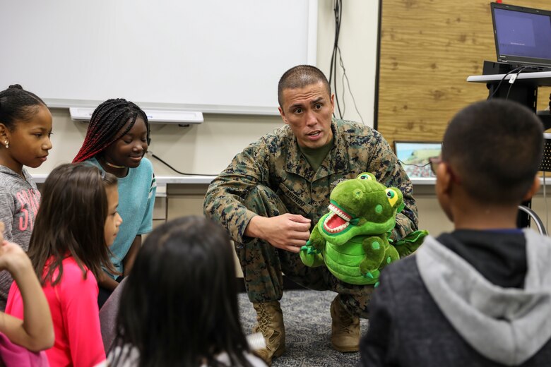 Petty Officer 2nd Class Mark D. Abundo speaks to students about the importance of oral health Feb. 5, 2019 on Camp Kinser, Okinawa, Japan. Sailors from Naval clinics in Okinawa held a presentation to promote oral health awareness during National Children’s Dental Health Month. Abundo, a hospital corpsman with Branch Dental Clinic Kinser, 3rd Dental Battalion, 3rd Marine Logistics Group, is a native of Camarillo, California. (U.S. Marine Corps photo by Armando Elizalde)