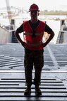 Cpl. David Vanpatton waits to ground guide a vehicle onto the ramp of the U.S.N.S. Pililaau (TAKR-304) during a maritime prepositioning force (MPF) offload for Cobra Gold 19 Feb. 3, 2019 at Laem Chabang Comercial Port, Thailand. The Pililaau is a Marine Corps MPF ship used to deliver Marine assets to areas in the Indo-Pacific region. Vanpatton is an electrical optical ordnance repairer with Combat Logistics Detachment 332, Combat Logistics Regiment 3, 3rd Marine Logistics Group, is a native of Riverside, California. (U.S. Marine Corps photo by Cpl. Jamin M. Powell)