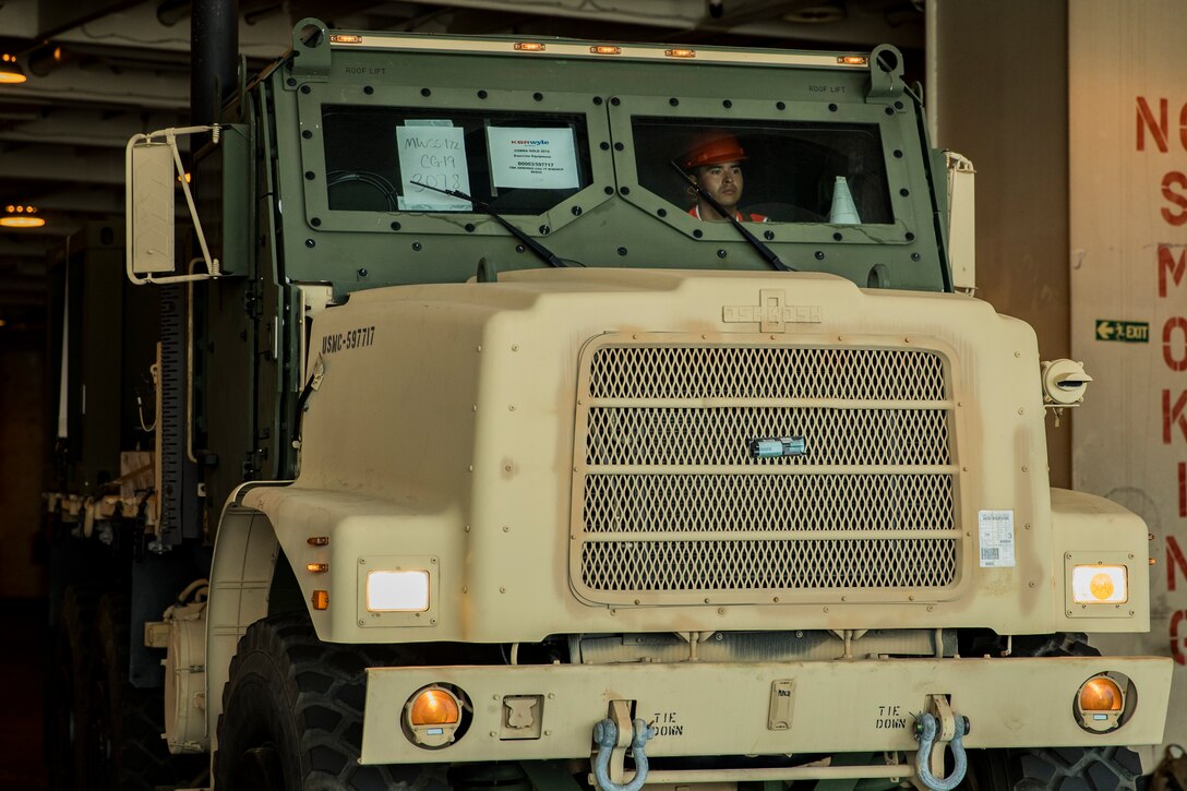 Lance Cpl. Carlos Hernandez drives a 7-ton truck during a maritime prepositioning force (MPF) offload of the U.S.N.S. Pililaau (TAKR-304) for Cobra Gold 19 Feb. 4, 2019 at Laem Chabang Commercial Port, Thailand. The Pililaau is a Marine Corps MPF ship used to deliver Marine assets to areas in the Indo-Pacific region. Hernandez, a motor transportation operator with Combat Logistics Detachment 332, Combat Logistics Regiment 3, 3rd Marine Logistics Group, is a native of Farmersville, California. (U.S. Marine Corps photo by Cpl. Jamin M. Powell)
