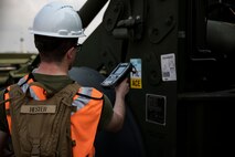 Lance Cpl. Zakary Hester scans the barcode on a front-end loader during a maritime prepositioning force (MPF) offload of the U.S.N.S. Pililaau (TAKR-304) for Cobra Gold 19 Feb. 4, 2019 at Laem Chabang Commercial Port, Thailand. The Common Logistics Command and Control System (CLC2S) is used to keep track of what gear comes on and off of the ship. The Pililaau is a Marine Corps MPF ship used to deliver Marine assets to areas in the Indo-Pacific region. Hester, a landing support specialist with Combat Logistics Detachment 332, Combat Logistics Regiment 3, 3rd Marine Logistics Group, is a native of Gainesville, Georgia. (U.S. Marine Corps photo by Cpl. Jamin M. Powell)