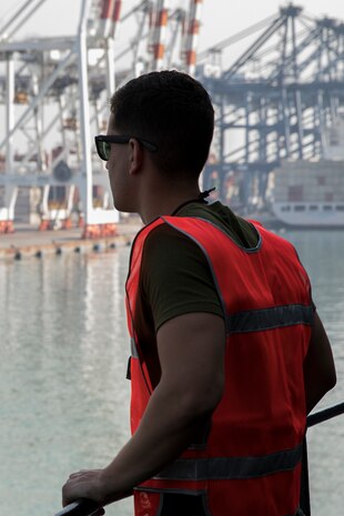 Cpl. Reyber Yero waits to begin offloading the U.S.N.S. Pililaau (TAKR-304) at Laem Chabang Commercial Port, Thailand for Cobra Gold 19 Feb. 3, 2019. The Pililaau is a Marine Corps maritime prepositioning force ship used to deliver Marine assets to areas in the Indo-Pacific region. Yero, a Motor transportation operator with Combat Logistics Detachment 332, Combat Logistics Regiment 3, 3rd Marine Logistics Group, is a native of Naples, Florida. (U.S. Marine Corps photo by Cpl. Jamin M. Powell)