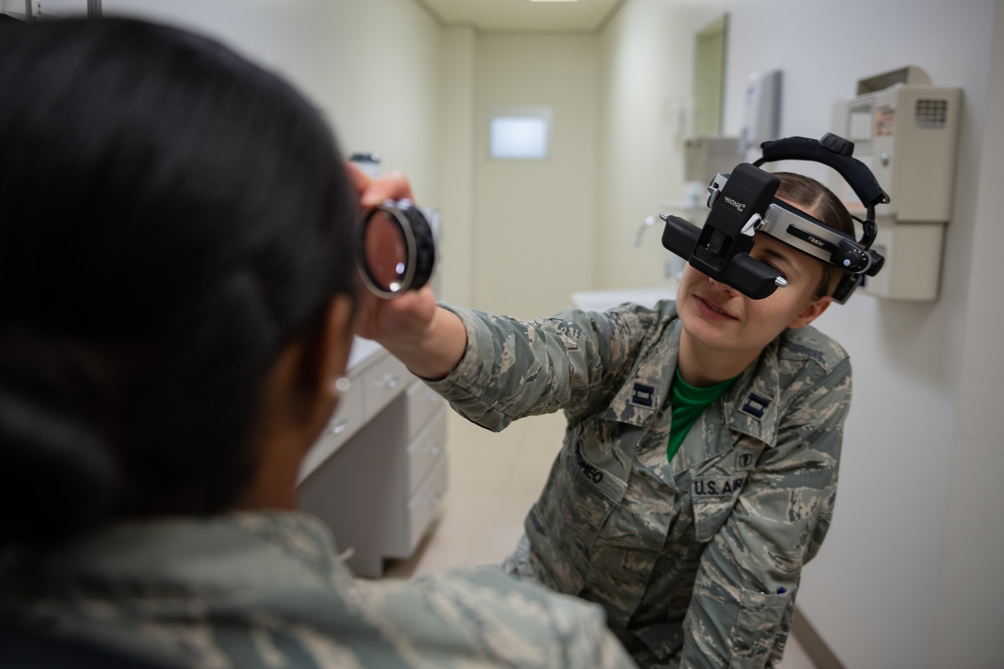 U.S. Air Force Capt. Suzanne Romeo, 18th Medical Group operational optometry chief, conducts a vision test Jan. 11, 2019, at Kadena Air Base, Japan. These practitioners do everything from prescribing correctional lenses to diagnosing conditions related to the ocular system. (U.S. Air Force photo by Staff Sgt. Micaiah Anthony)