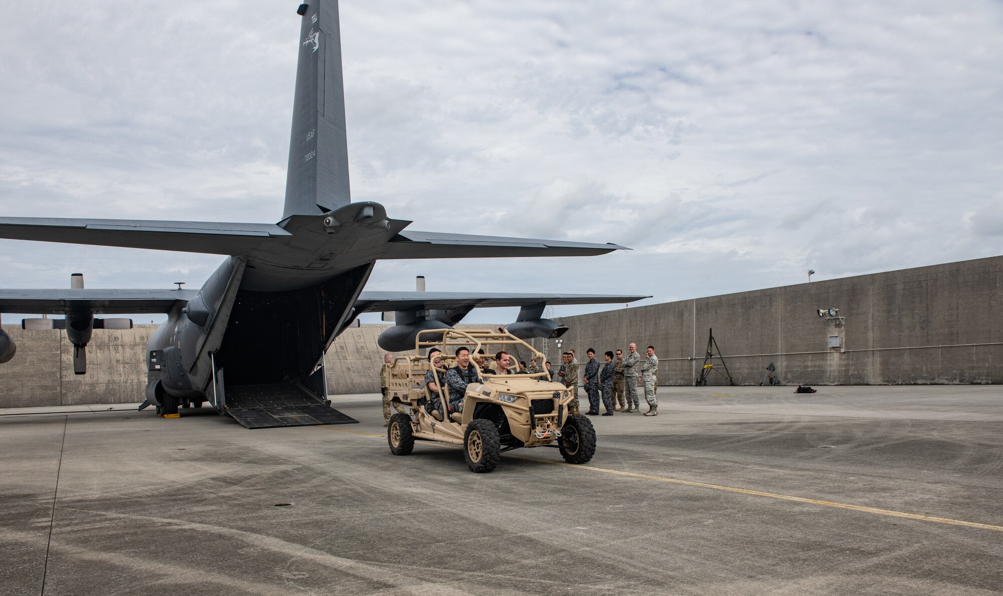 Japan Air Self-Defense Force Airmen and U.S. service members take part in an MC-130H Combat Talon II infiltration and exfiltration demonstration Nov. 19, 2018, during the 2018 Bilateral Exchange at Kadena Air Base, Japan. The event included professional enhancement seminars, physical training, a historical tour and team building exercises. (U.S. Air Force photo by Staff Sgt. Micaiah Anthony)