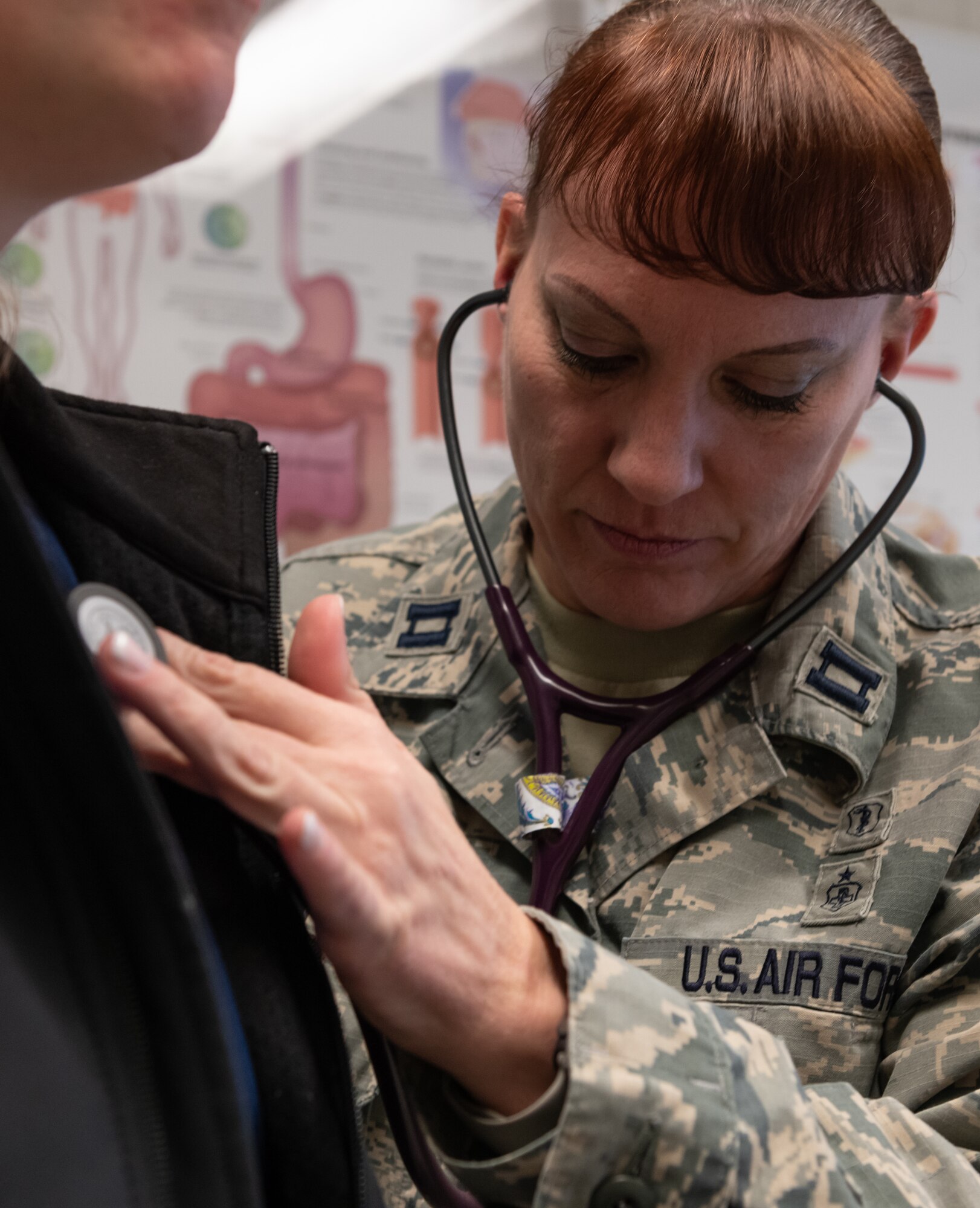U.S. Air Force Capt. Andrea Tidd, 18th Medical Services Flight commander and physician assistant, examines the ear of Deana Ladd, 18th Medical Group registered nurse, Jan. 23, 2019, at Kadena Air Base, Japan. Physician assistants often serve as a patient’s principal healthcare provider. Their role in patient care consists of diagnosing illnesses, developing and managing treatment plans and prescribing medications. (U.S. Air Force photo by Staff Sgt. Micaiah Anthony)