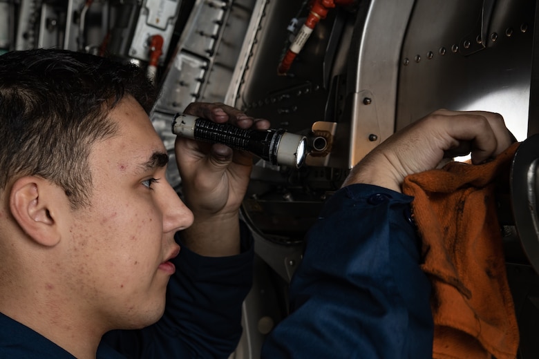 U.S. Air Force Airman 1st Class Jack O’Connell, 18th Aircraft Maintenance Squadron crew chief, cleans an F-15 Eagle engine bay compartment, Jan. 18, 2019, on Kadena Air Base, Japan. Over time, dirt, grease and grime can build up in the aircrafts engine bay and can cover up cracks or other discrepancies on the aircraft. (U.S. Air Force photo by Staff Sgt. Micaiah Anthony)