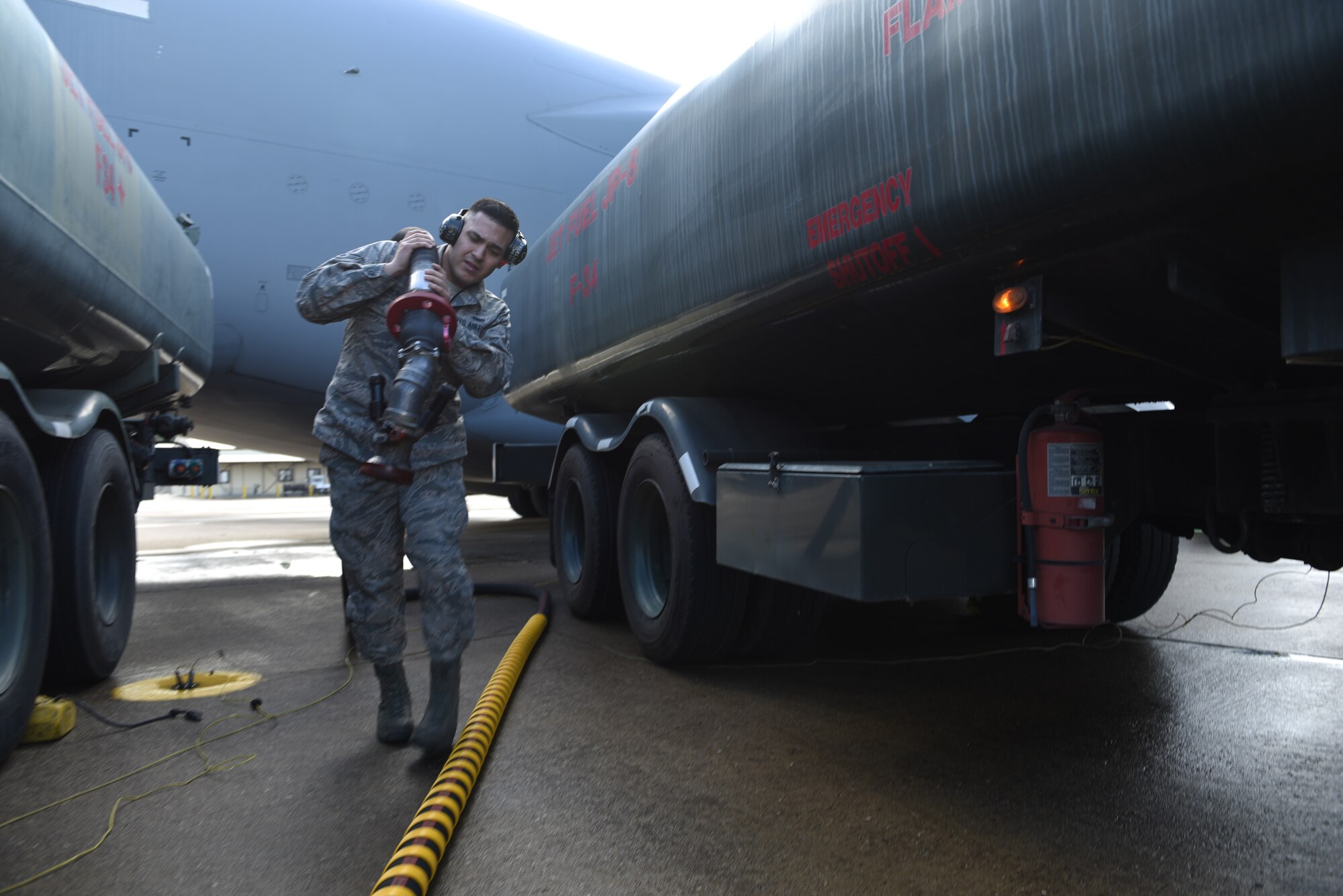 U.S. Air Force Airman 1st Class Gabriel Praslin-Trewin, 39th Logistics Readiness Squadron fuels specialist, returns the fuel hose after filling up an aircraft at Incirlik Air Base, Turkey, Feb. 1, 2019.