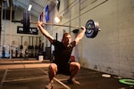 U.S. Air Force Tech. Sgt. Brandon, a member of the 118th Wing, Tennessee Air National Guard, performs an overhead squat during a high-intensity workout Feb. 9, 2019, at Berry Field Air National Guard Base, Nashville, Tennessee. An owner of two gyms and a meal preparation company, Brandon credits his military service with enabling him to find his physical fitness talents.