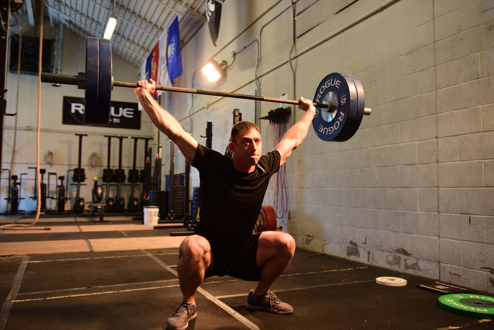 U.S. Air Force Tech. Sgt. Brandon, a member of the 118th Wing, Tennessee Air National Guard, performs an overhead squat during a high-intensity workout Feb. 9, 2019, at Berry Field Air National Guard Base, Nashville, Tennessee. An owner of two gyms and a meal preparation company, Brandon credits his military service with enabling him to find his physical fitness talents.