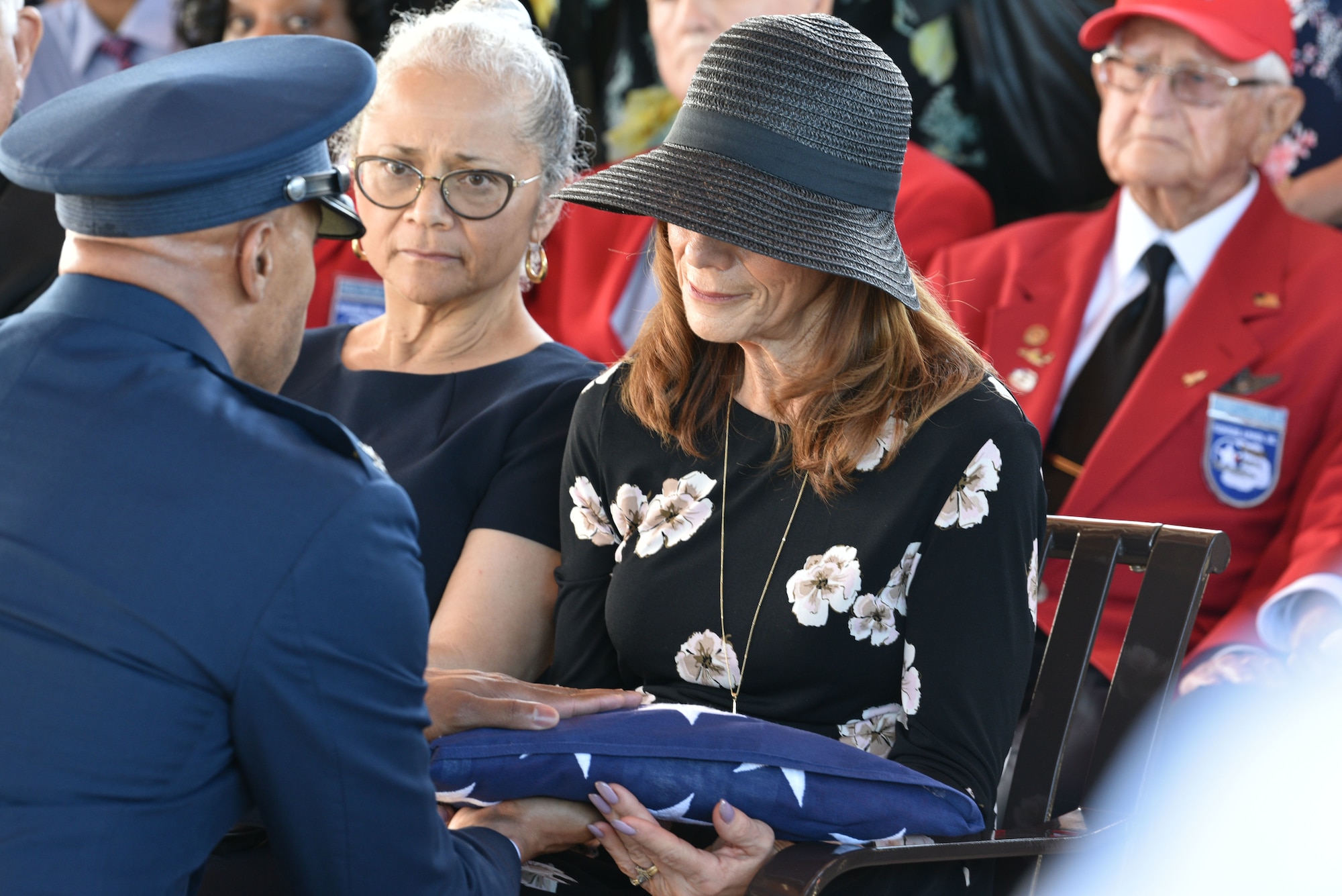 Col. Kevin Williams, 45th Mission Support Group commander, hands the flag to Shelley Cowan Arnold, daughter of Edwin Cowan, Tuskegee Airman, during a funeral, Feb. 7, 2019 at Cape Canaveral National Cemetery in Mims, Fla. Edwin Cowan was buried with full military honors and was buried alongside his wife Theda. (U.S. Air Force photo by Airman 1st Class Dalton Williams)