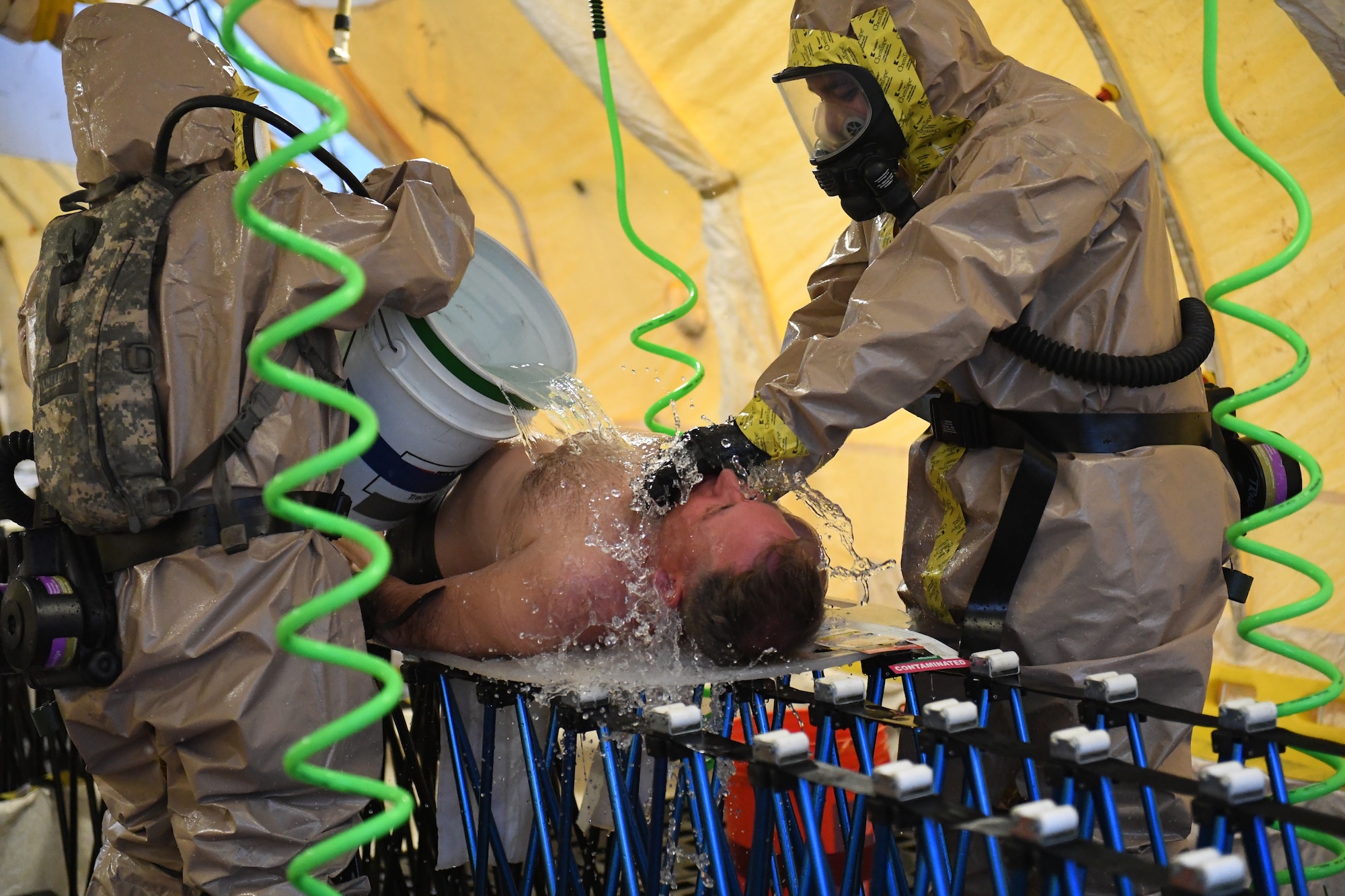Army Maj. George Hurd, the 6th CERFP battalion commander, volunteers to play a patient who has to be decontaminated by a couple of Army National Guard engineers out of Kingsville, Texas Feb. 5 2019.