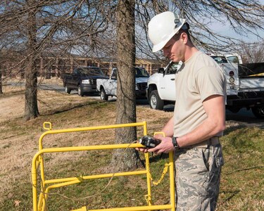 U.S. Air Force Airman 1st Class Kaden Norwood, 633rd Communication Squadron cable and antenna technician, monitors the gas reader during routine cable checks on Joint Base Langley-Eustis, Virginia, February 8, 2019.