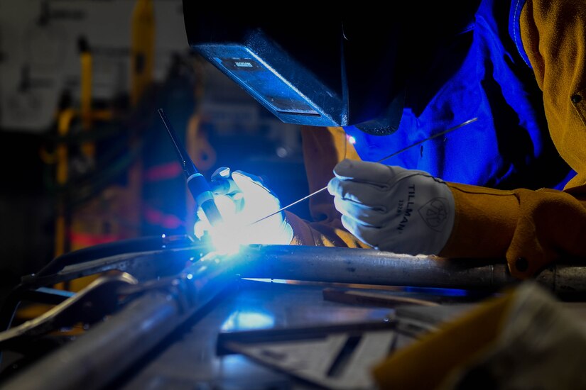 U.S. Army Sgt. Kevin Blane, 558th Transportation Company, 10th Trans. Battalion, 7th Trans. Brigade (Expeditionary) allied trade specialist, repairs a weld at Joint Base Langley-Eustis, Virginia, Jan. 23, 2019. Allied trade specialists perform fabrications, repair and modify metallic and nonmetallic parts using lathes, drill presses, grinders and the Computer Numeric Control machine. (U.S. Air Force photo by Senior Airman Derek Seifert)