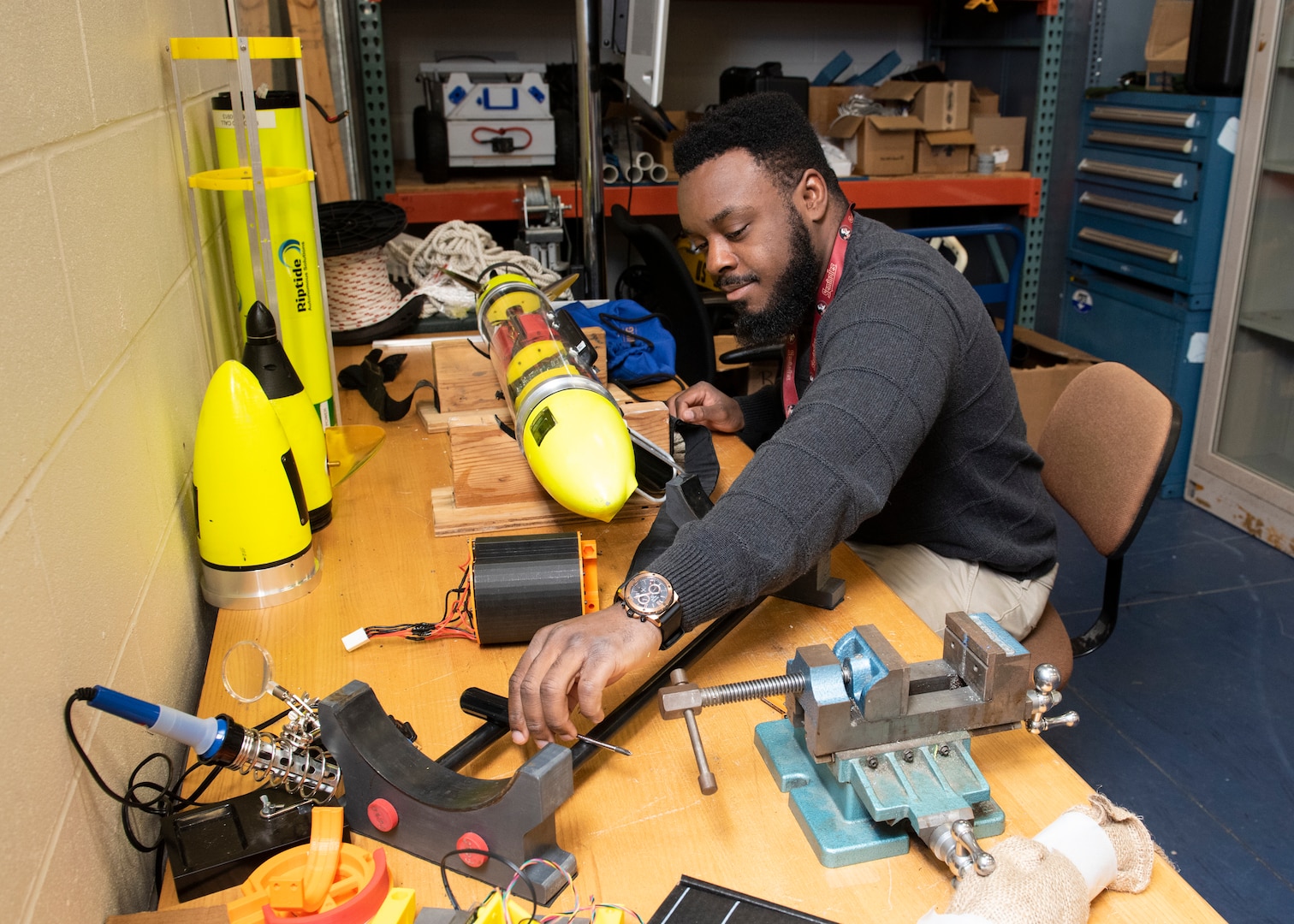 Naval Surface Warfare Center Panama City Division Mechanical Engineer Harry Philippeaux integrates and assembles components of a Riptide Unmanned Underwater Vehicle.
