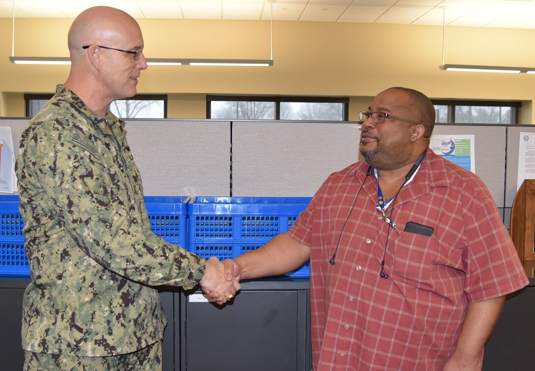 Distribution’s Sims presented with commander’s coin