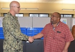 Distribution’s Sims presented with commander’s coin