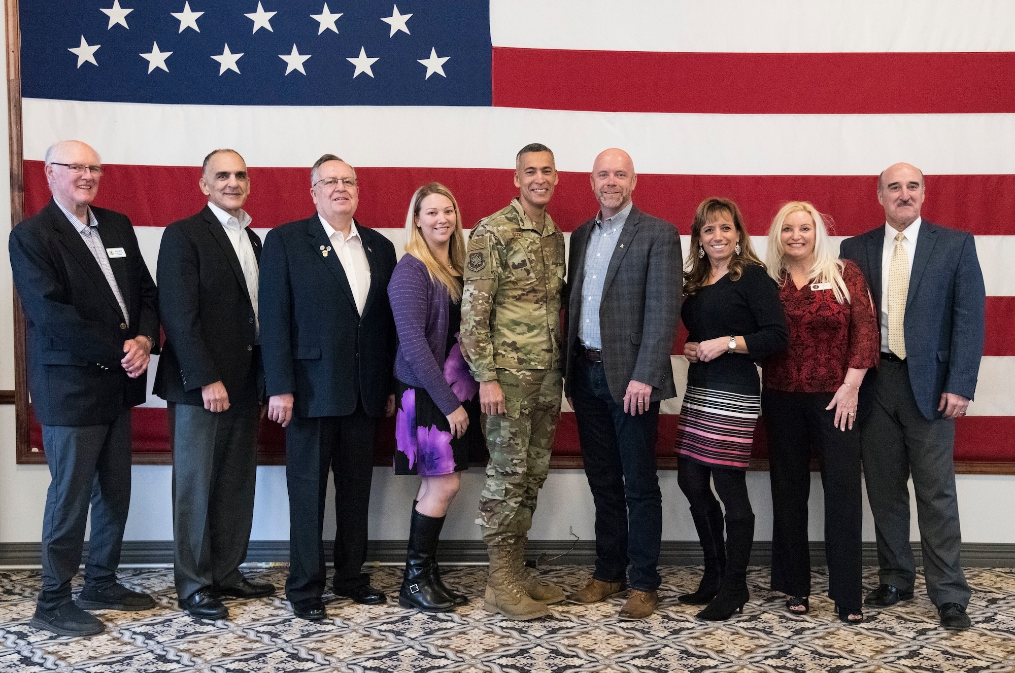 U.S. Air Force Chief Master Sgt. Terrence Greene, command chief of Air Mobility Command, Scott Air Force Base, Ill., and AMC civic leaders pose for a photo Feb. 7, 2019, at The Landings Club on Dover Air Force Base, Del. Greene thanked the civic leaders on their continued involvement and support of the base, personnel and family members. (U.S. Air Force photo by Roland Balik)