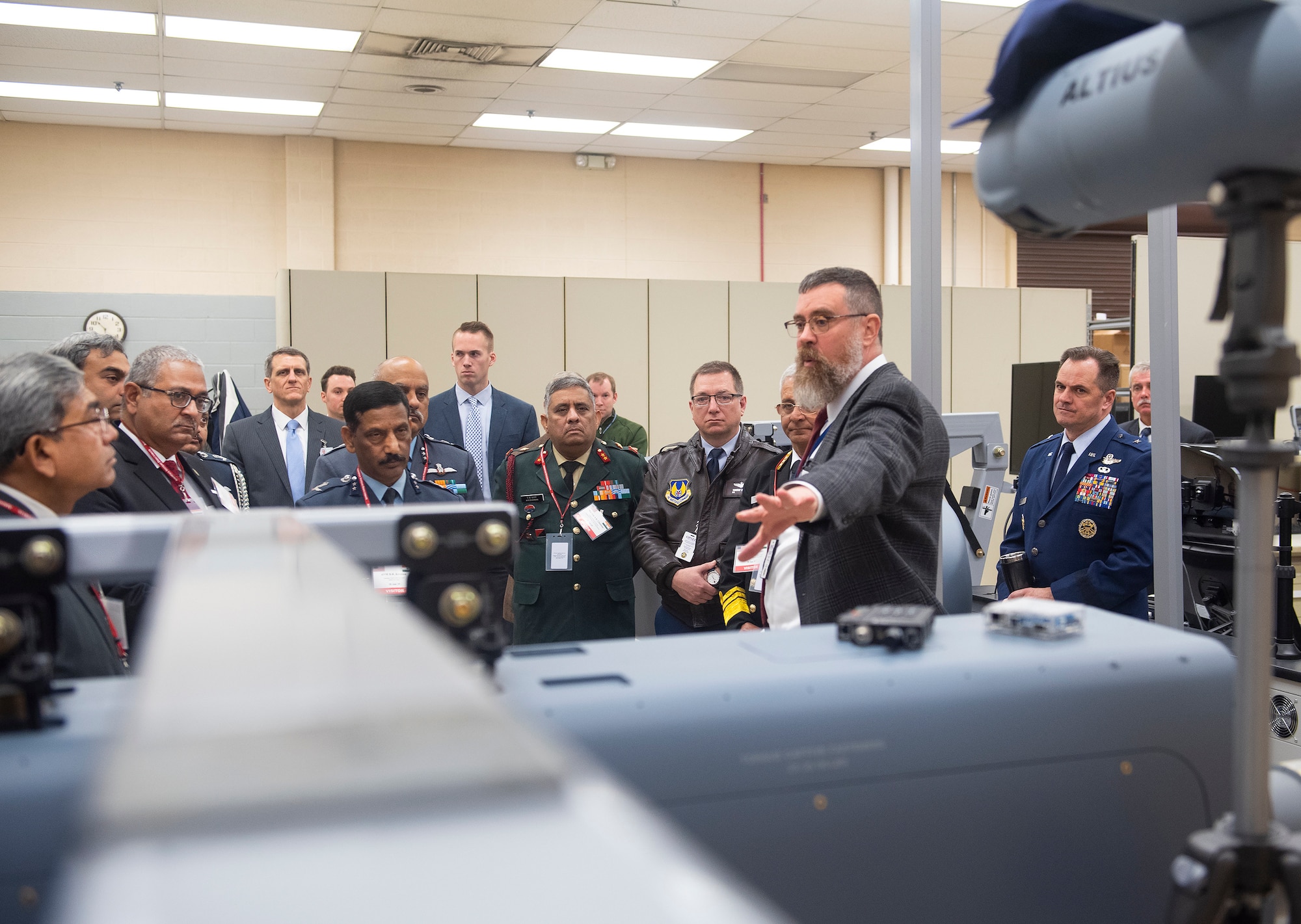 Paul Fleitz, Air Force Research Laboratory Air-Launched Off-Board Operations team lead, shows a visiting Indian military delegation through the ALOBO research facility on Wright-Patterson Air Force Base, Ohio, Jan. 30, 2019. AFRL hosted the delegation in an effort to increase international scientific and technological engagement. (U.S. Air Force photo by R.J. Oriez)