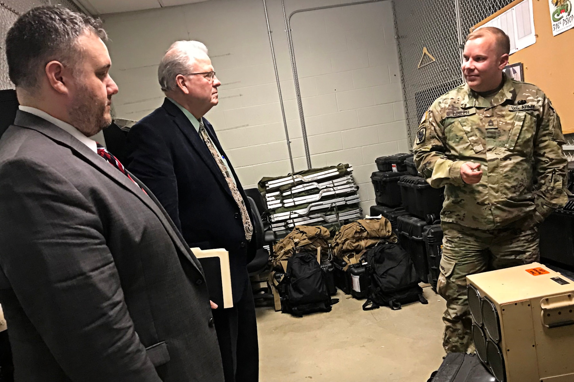 Sgt. 1st Class Mark Gisler, the company’s noncommissioned officer in charge of the 316th Psychological Operations Company, talks with Jon Kenworthy, left, and Jerry Alexander from Sen. Mike Braun’s support staff Feb. 5, 2019 at Grissom Air Reserve Base, Indiana. The two stopped in for an informational tour of the base and units stationed here. (U.S. Air Force photo/Douglas Hays)