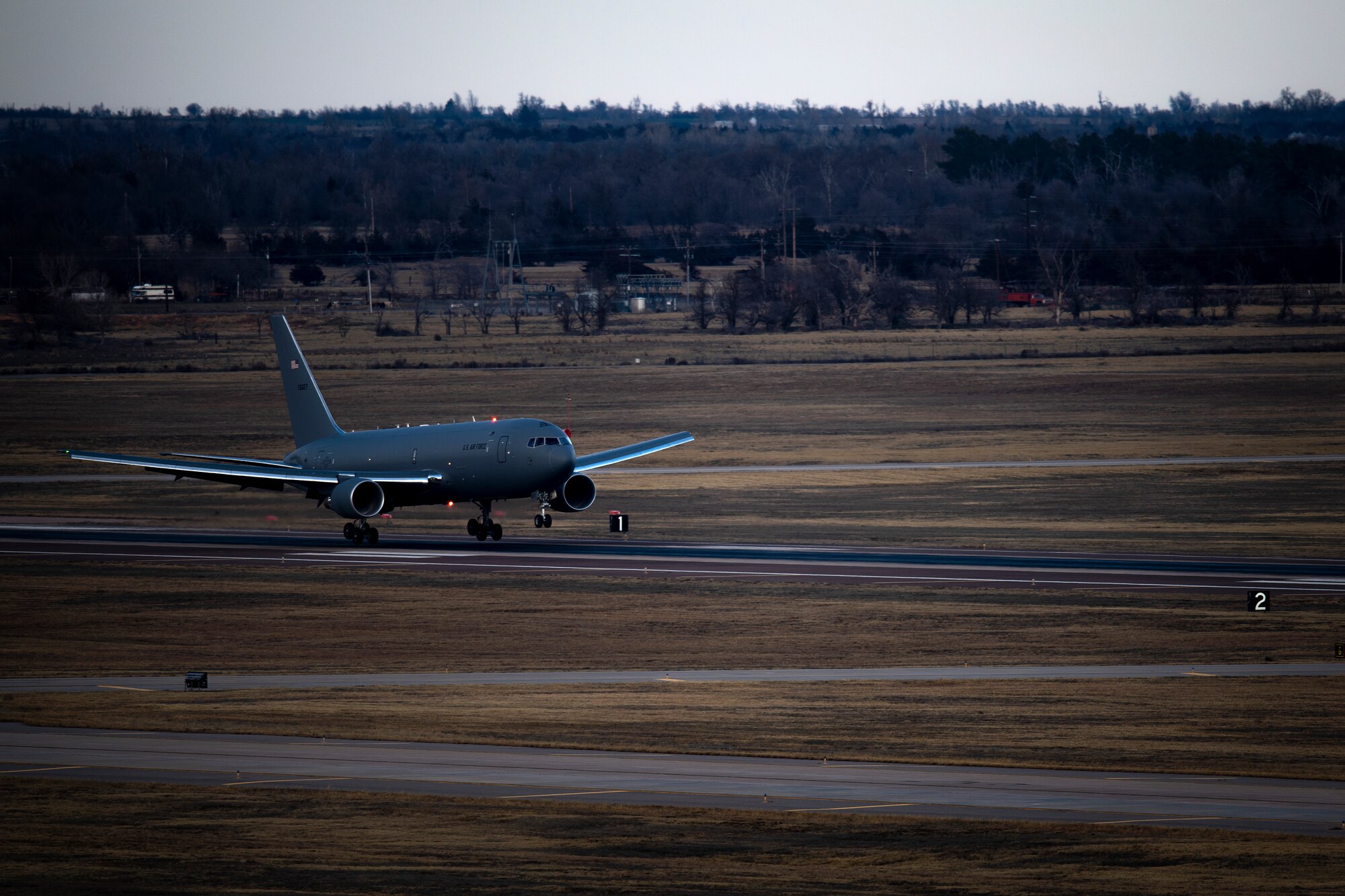 A KC-46 Pegasus lands on a runway of the 97th Air Mobility Wing for the first time Feb. 8, 2019, at Altus Air Force Base, Okla.