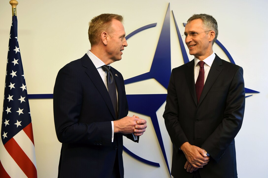 Acting Defense Secretary Patrick M. Shanahan stands next to NATO Secretary General Jens Stoltenberg.