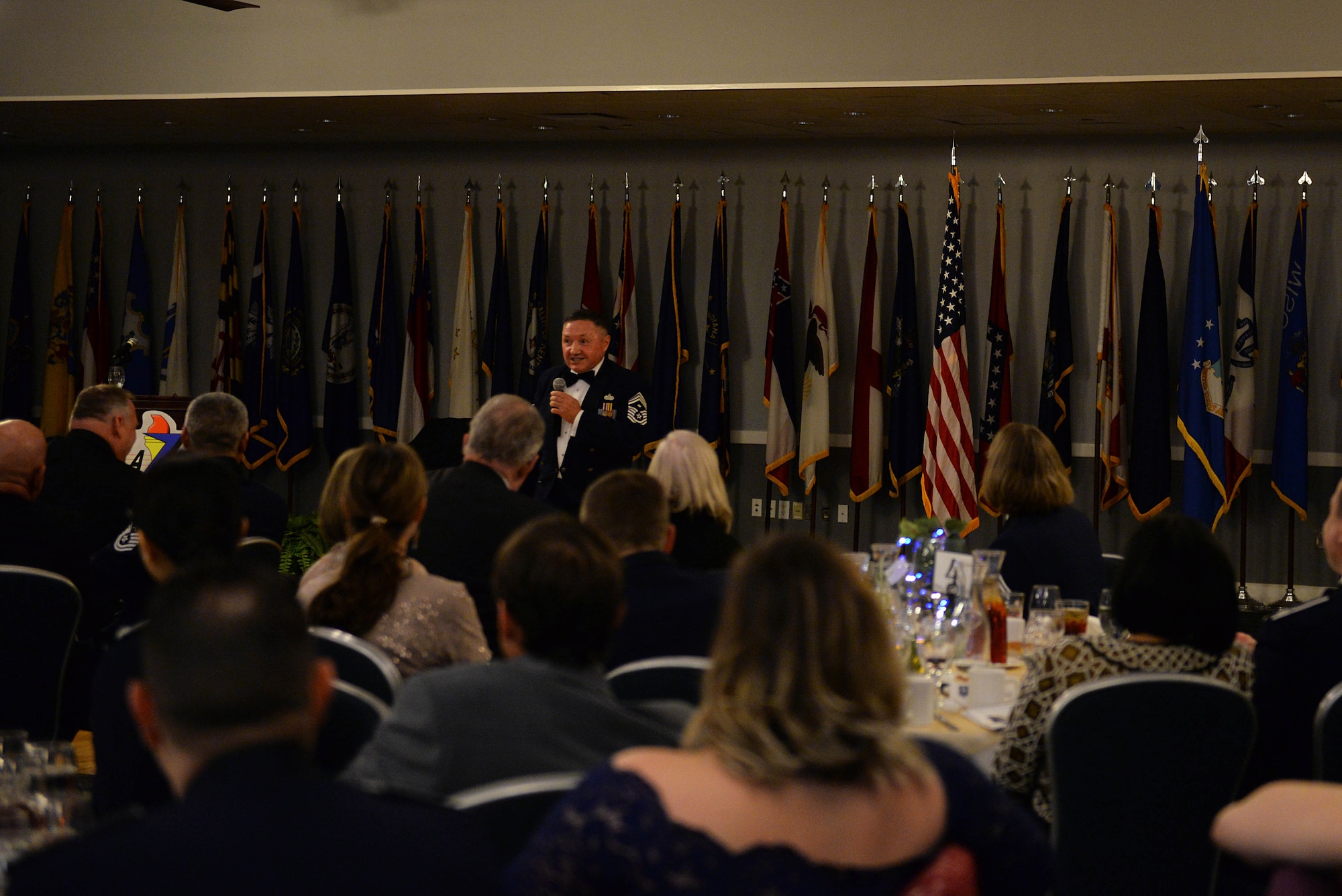 Retired Chief Master Sgt. Thomas Pelfrey, former first sergeant of the 14th Operations Group, gives a speech during the 14th Flying Training Wing’s 2018 Annual Awards Banquet Feb. 8, 2019, at the Club on Columbus Air Force Base, Mississippi. Pelfrey spoke about past experiences and gave insight into lifestyles. (U.S. Air Force photo by Airman Hannah Bean)