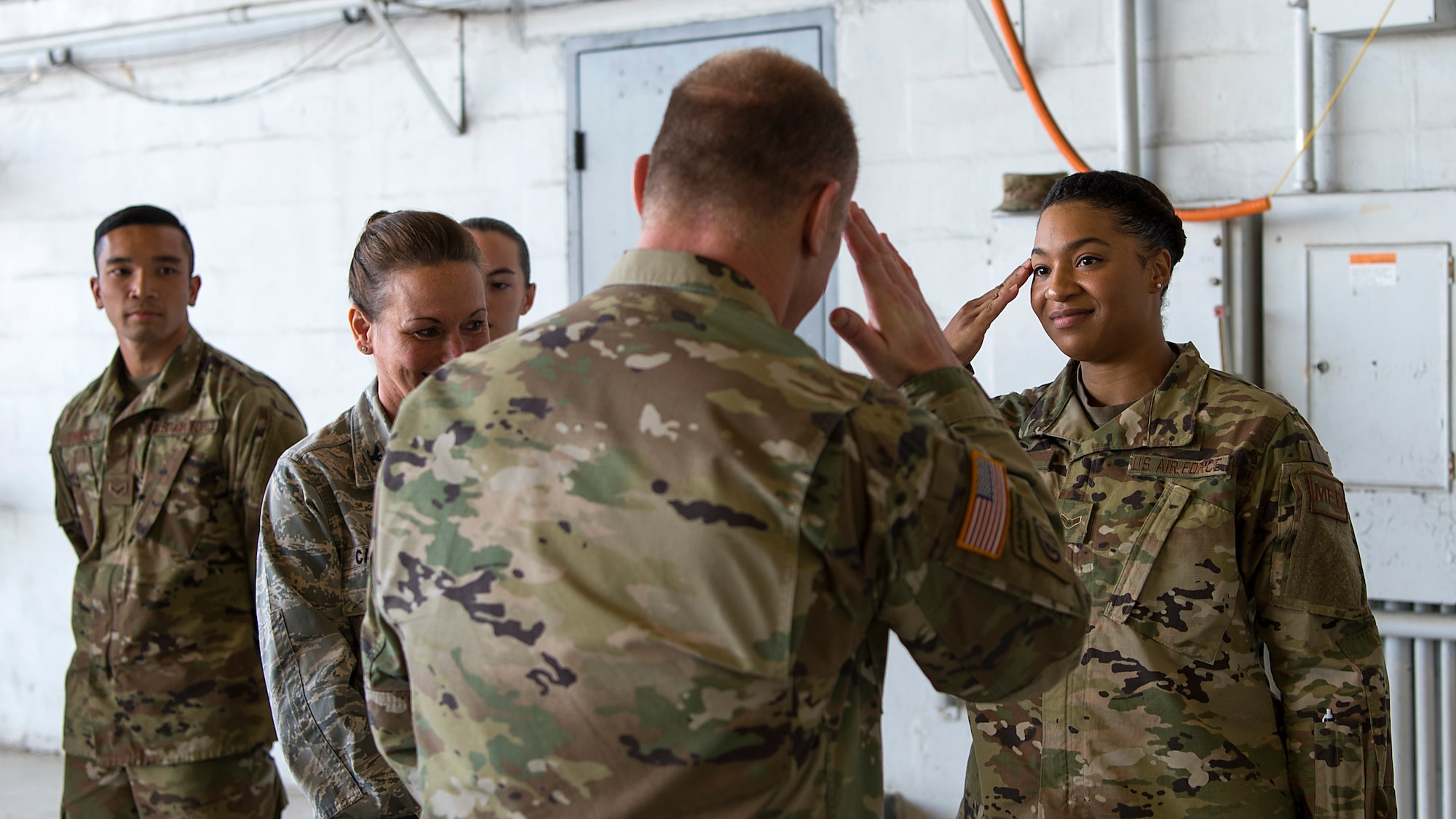 U.S. Air Force Airman 1st Class Kiera Steen, a medical technician assigned to the 6th Medical Operations Squadron, salutes U.S. Army Gen. Stephen Lyons, U.S. Transportation Command commander, after he presented her a coin for outstanding performance at MacDill Air Force Base, Fla., Feb. 8, 2019. While at MacDill, Lyons visited the 6th Air Mobility Wing, U.S. Central Command, and the Joint Communications Support Element. USTRANSCOM is a unified, functional combatant command that provides support to the nine other U.S. combatant commands, the military services, defense agencies and other government organizations.