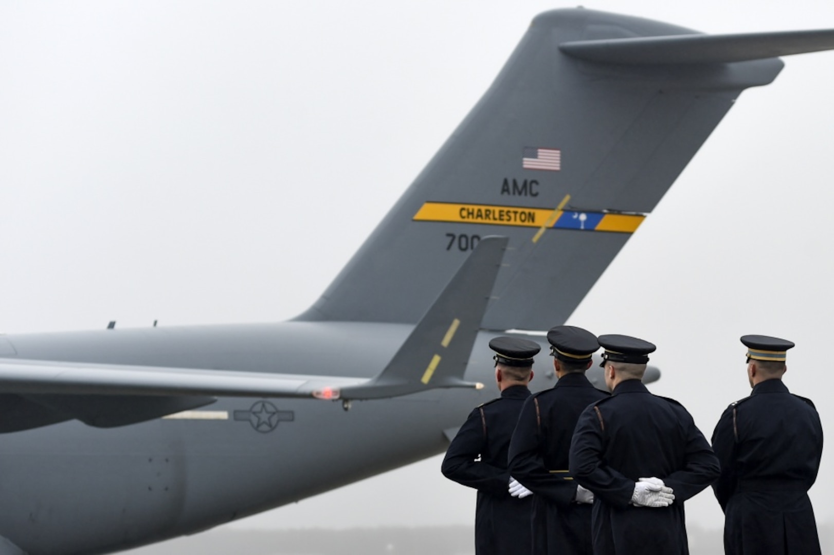 The U.S. Army 3rd Infantry Regiment (The Old Guard) body bearer team falls into formation as an Air Mobility Command C-17 Globemaster III arrives at Joint Base Andrews, Md. with the remains of World War II Army veteran and former Rep. John D. Dingell (D-Mich.) Feb. 12, 2019.