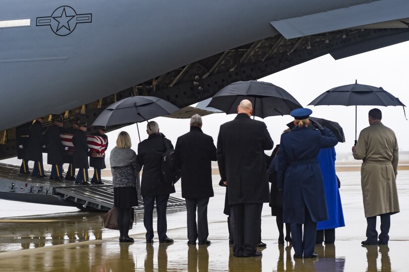A C-17 Globemaster III assigned to the 315th Airlift Wing, Joint Base Charleston, South Carolina, carrying the casket of former World War II veteran and Congressman John D. Dingell lands on Joint Base Andrews, Md., Feb. 12, 2019.