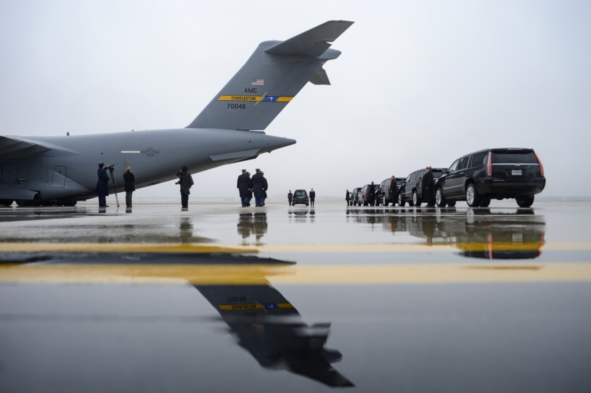 The U.S. Army 3rd Infantry Regiment (The Old Guard) body bearer team fall into formation as an Air Mobility Command C-17 Globemaster III arrives at Joint Base Andrews, Md. with the remains of World War II Army veteran and former Rep. John D. Dingell (D-Mich.) Feb. 12, 2019.