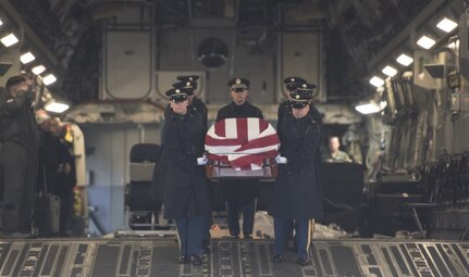 The U.S. Army 3rd Infantry Regiment (The Old Guard) body bearer team carries the casket of former World War II Army veteran and Congressman John D. Dingell at Joint Base Andrews, Md., Feb. 12, 2019.