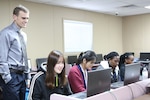 Kevin Lambert, a teacher at Layton Christian Academy in Utah, oversees his students as they work on computers donated to the school through the DoD Computers for Learning Program and DLA Disposition Services.