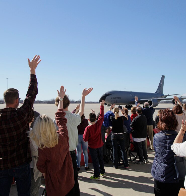 Family members await the arrival of Airmen returning home from a deployment at Selfridge Air National Guard Base, Mich., Feb. 19, 2017.