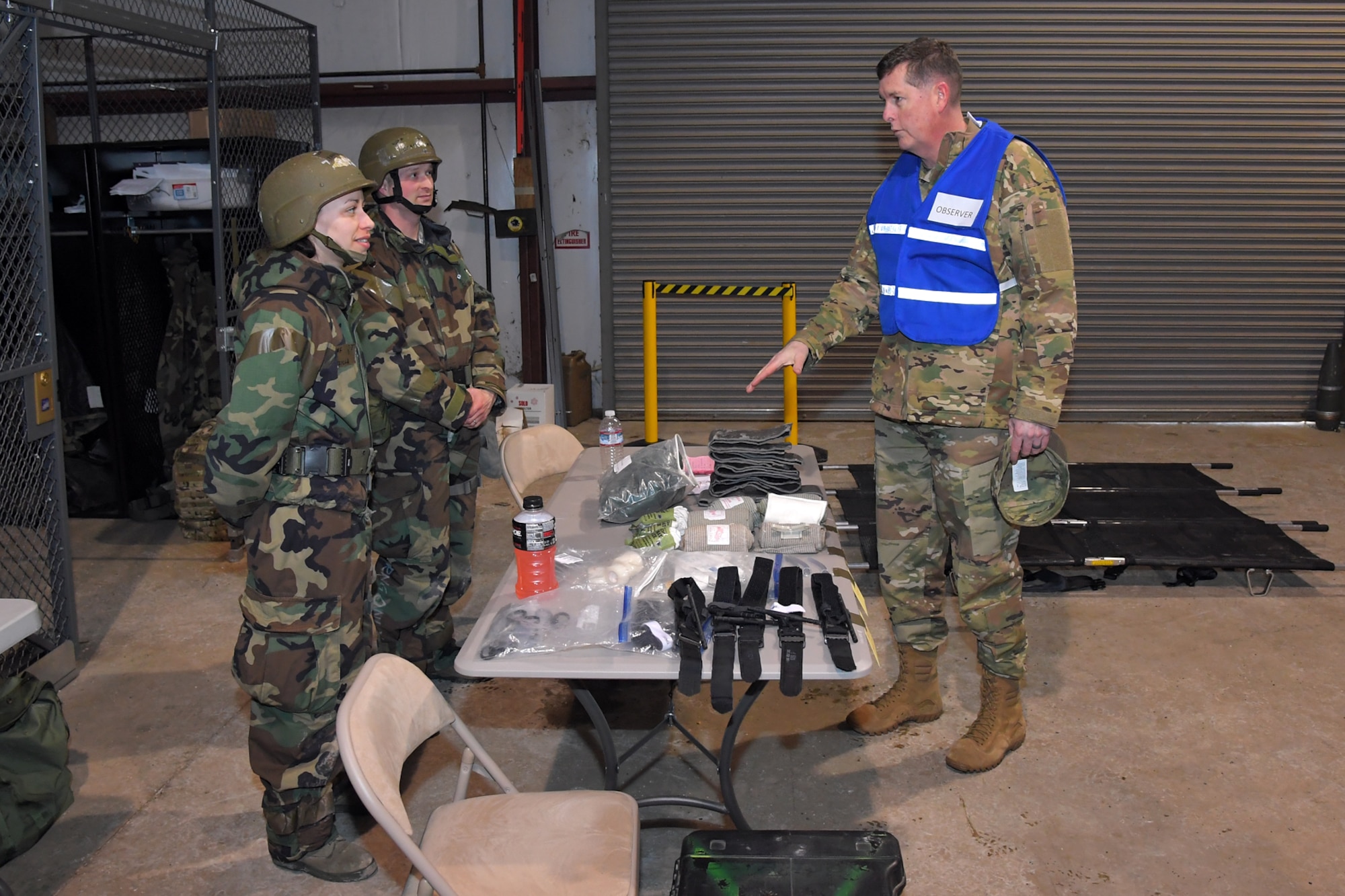 Lt. Gen. Gene Kirkland, Air Force Sustainment Center commander, discusses medical readiness with Staff Sgt. Priscilla Webb, 75th Medical Operations Squadron, and Capt. Isaac Yourison, 75th Aerospace Medicine Squadron, during a readiness exercise Feb. 7, 2019, at Hill Air Force Base, Utah.