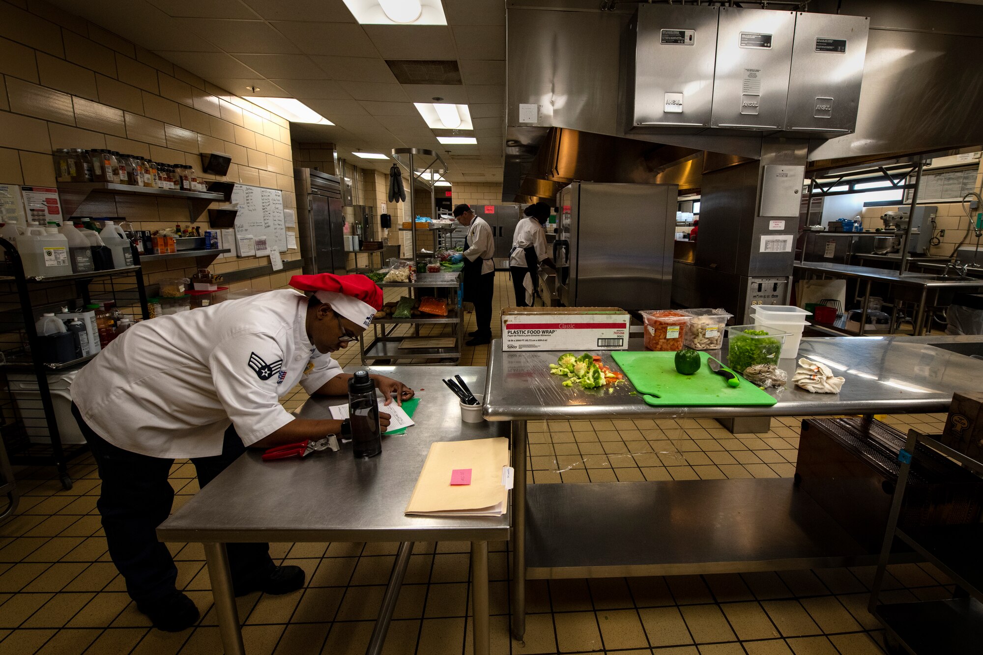 Senior Airman Waikoloah Shedrick, a food services specialist assigned to the 97th Force Support Squadron Hangar 97 Dining Facility, prepares a schedule, Jan. 10, 2019 at Altus Air Force Base, Okla.