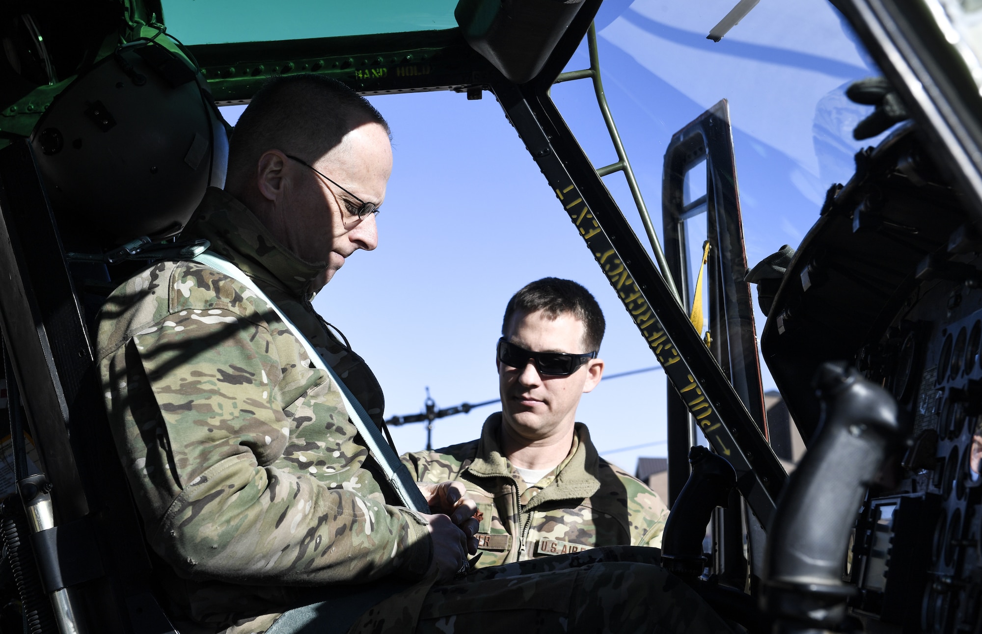 Maj. Gen. Mark E. Weatherington, Air Education and Training Command deputy commander, is assisted by Maj. Zachary Minner, 512th Rescue Squadron director of staff