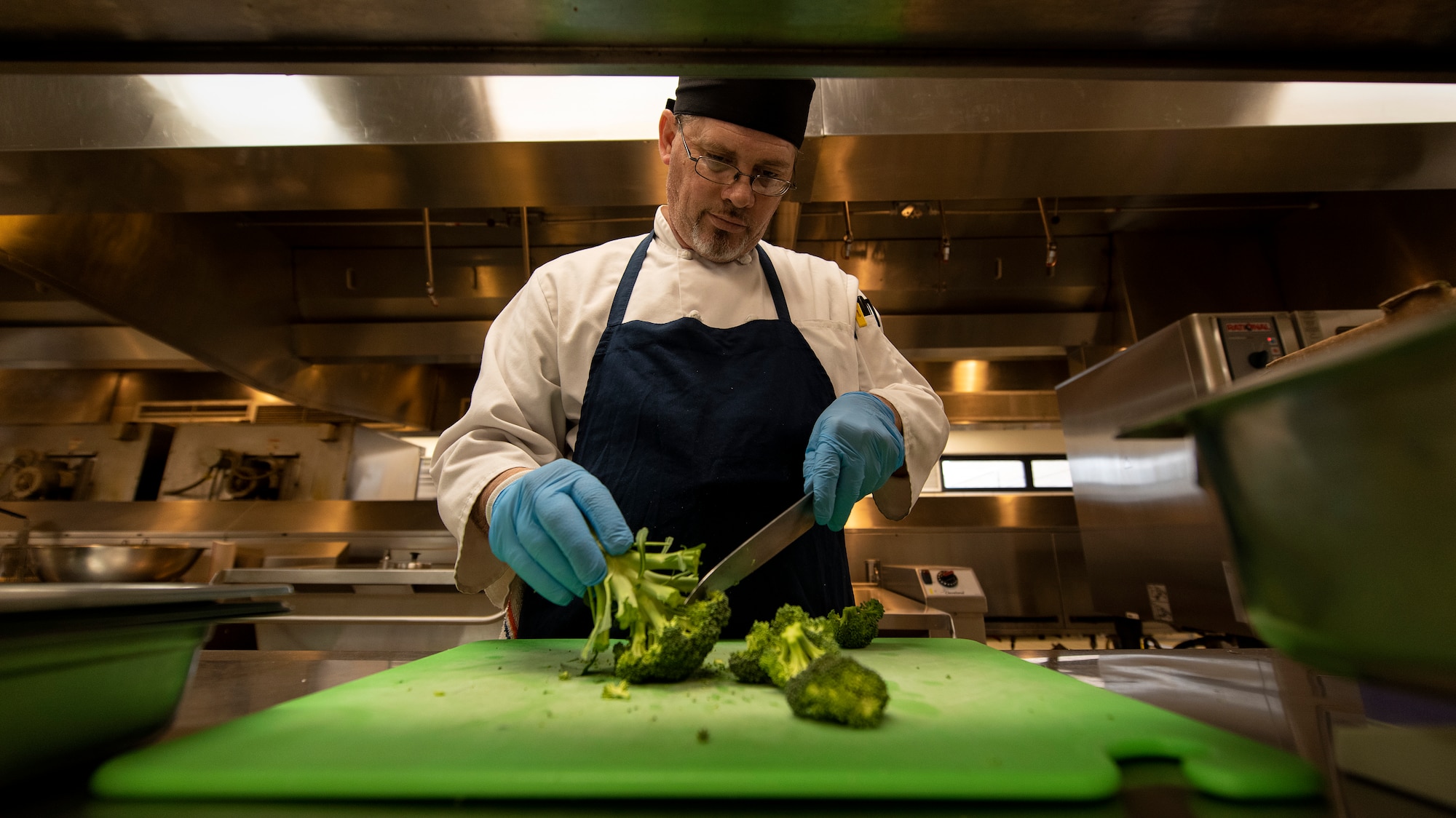 Gerald Whitehead, a cook from the Hangar 97 Dining Facility, prepares food, Jan. 10, 2019 at Altus Air Force Base, Okla.