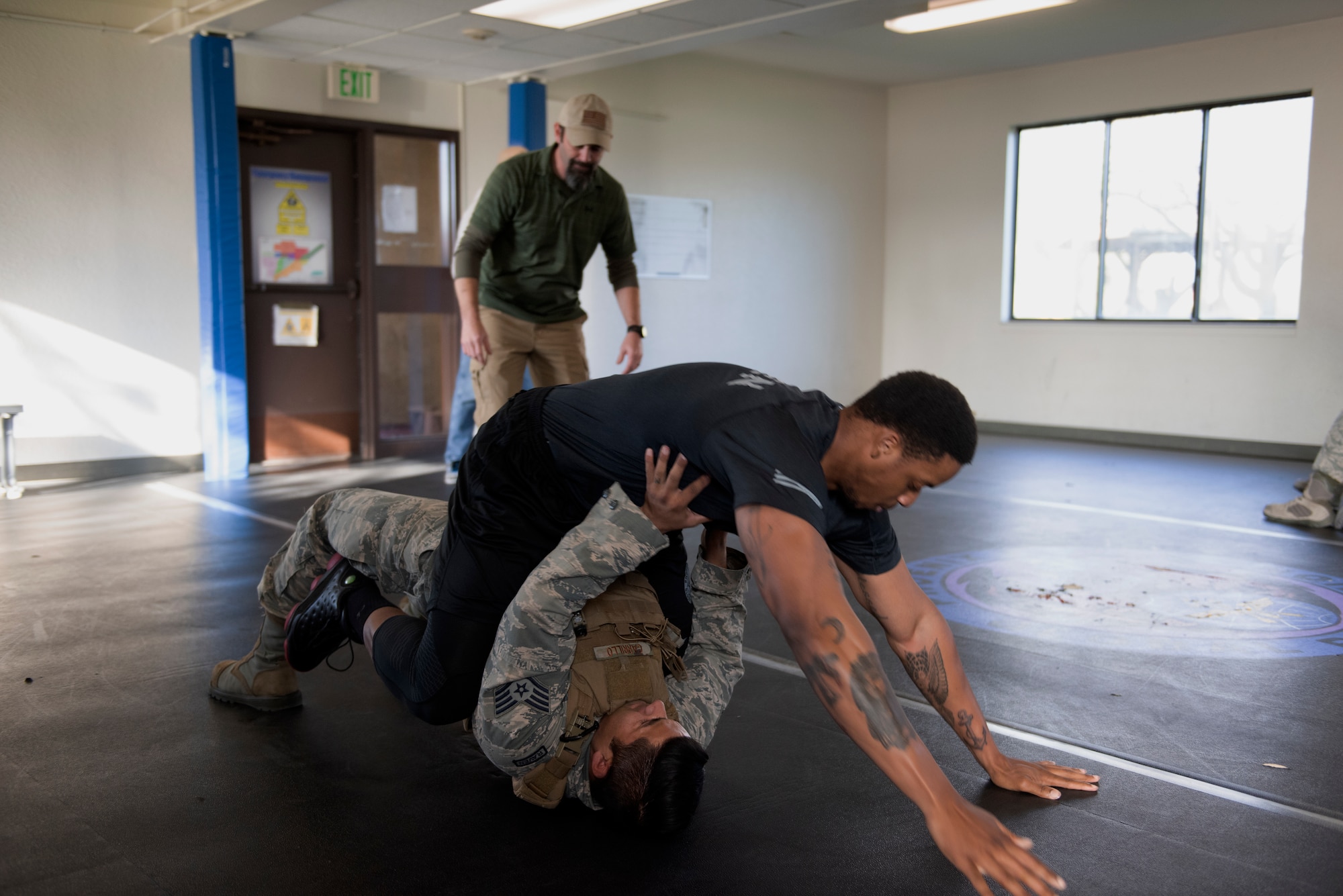 Airmen assigned to the 60th Security Forces Squadron demonstrate combative skills Feb 7, 2019 at Travis Air Force Base, Calif. These skills help security forces Airmen defend themselves from attack. (U.S. Air Force photo by Tech. Sgt. James Hodgman)