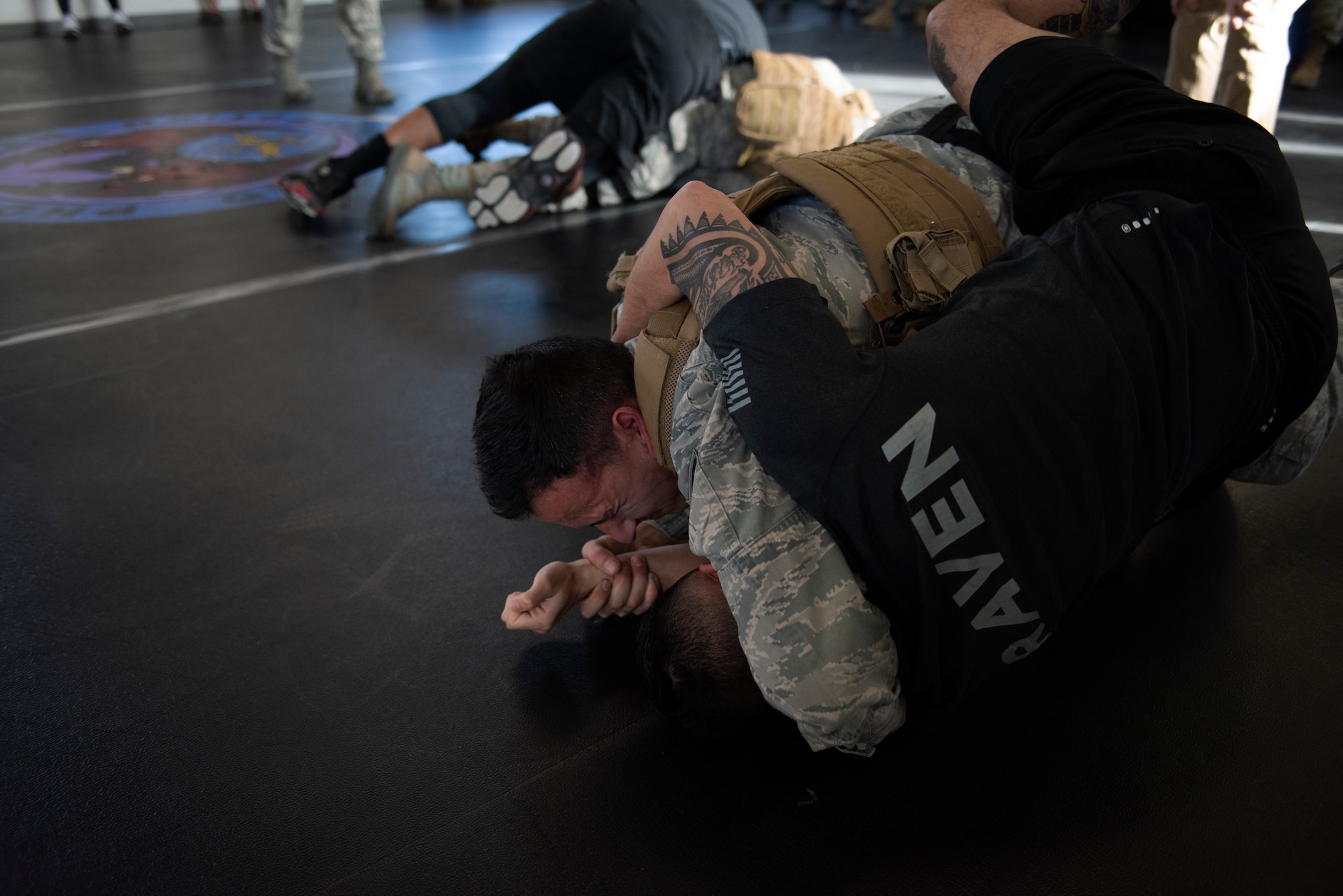 Airmen assigned to the 60th Security Forces Squadron demonstrate combative skills Feb 7, 2019 at Travis Air Force Base, Calif. These skills help security forces Airmen defend themselves from attack. (U.S. Air Force photo by Tech. Sgt. James Hodgman)