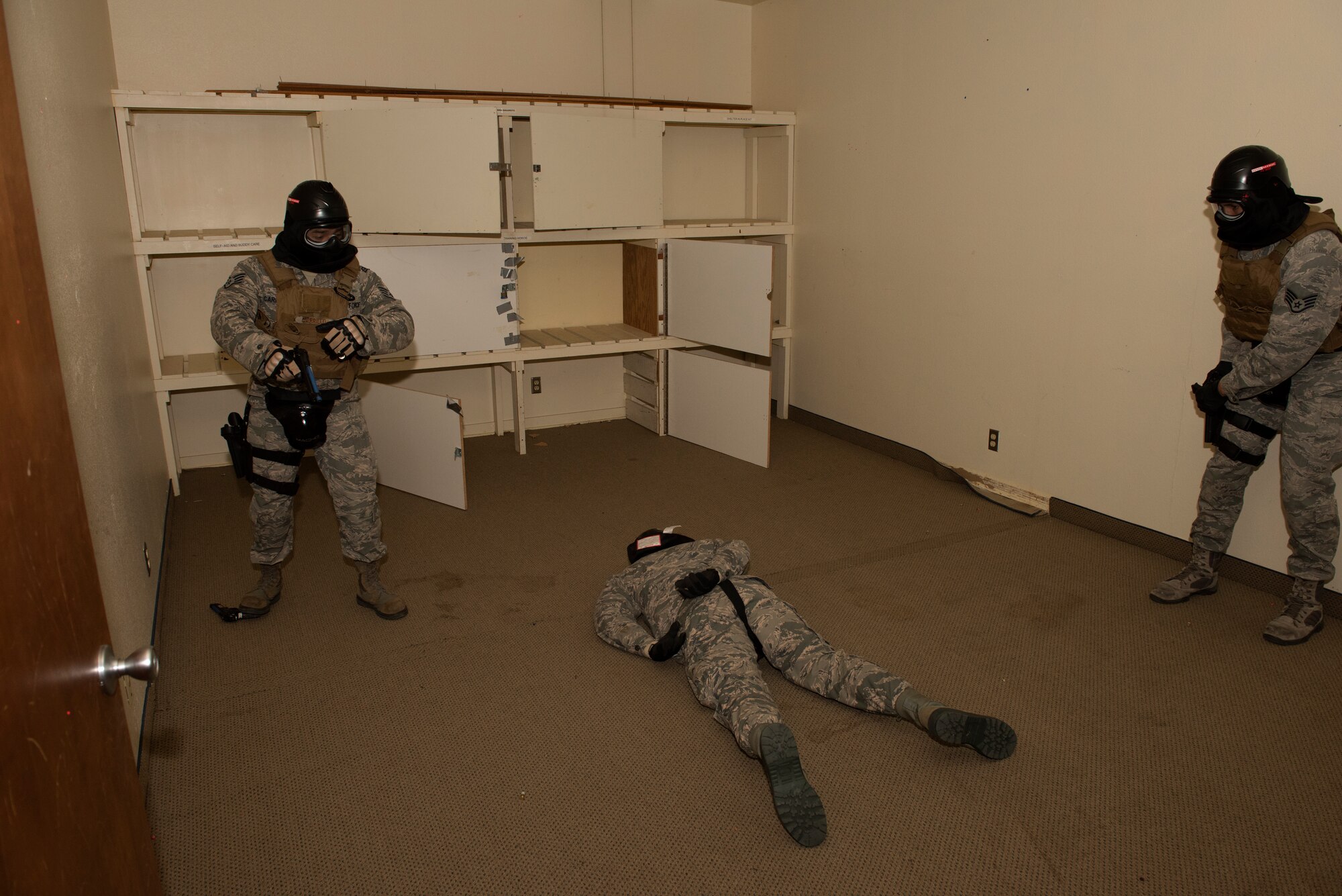 Airmen assigned to the 60th Security Forces Squadron conduct use of force training Feb 7, 2019 at Travis Air Force Base, Calif. Security forces Airmen train regularly to be ready for a variety of scenarios. (U.S. Air Force photo by Tech. Sgt. James Hodgman)