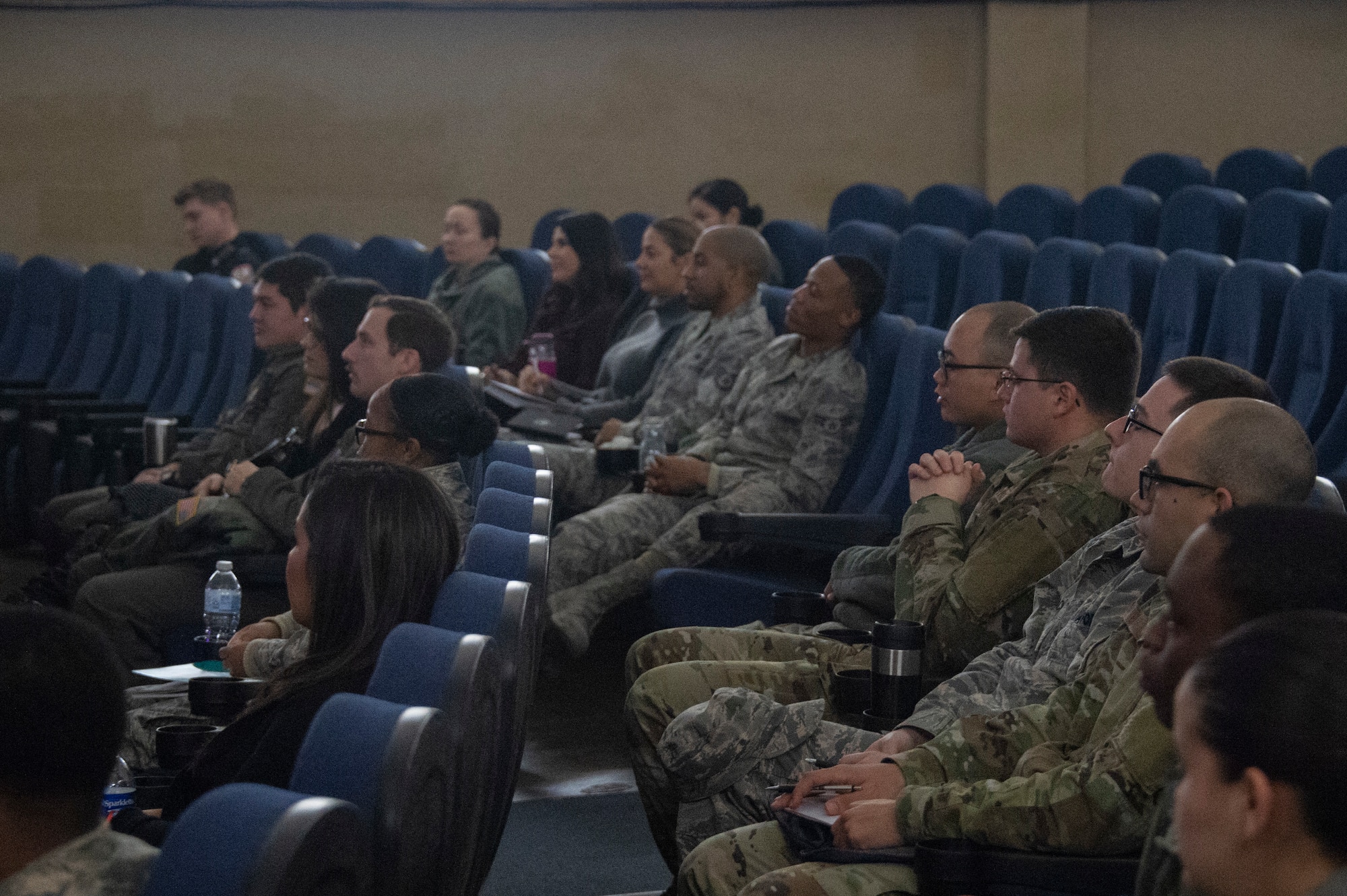 Members of the 97th Air Mobility Wing listen to the Enhancing Human Capitol seminar