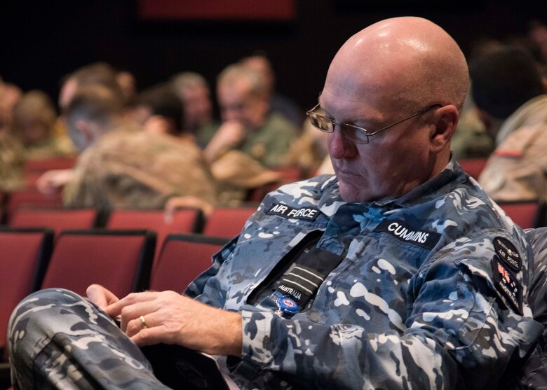 Wing Commander Brady Cummins, Australian representative on the Management Committee for the Five Eyes Air Force Interoperability Council, takes notes during a briefing at the Mobility Guardian 2019 Combined Mid Planning Conference held at Fairchild Air Force Base, Washington, Feb. 5, 2019.