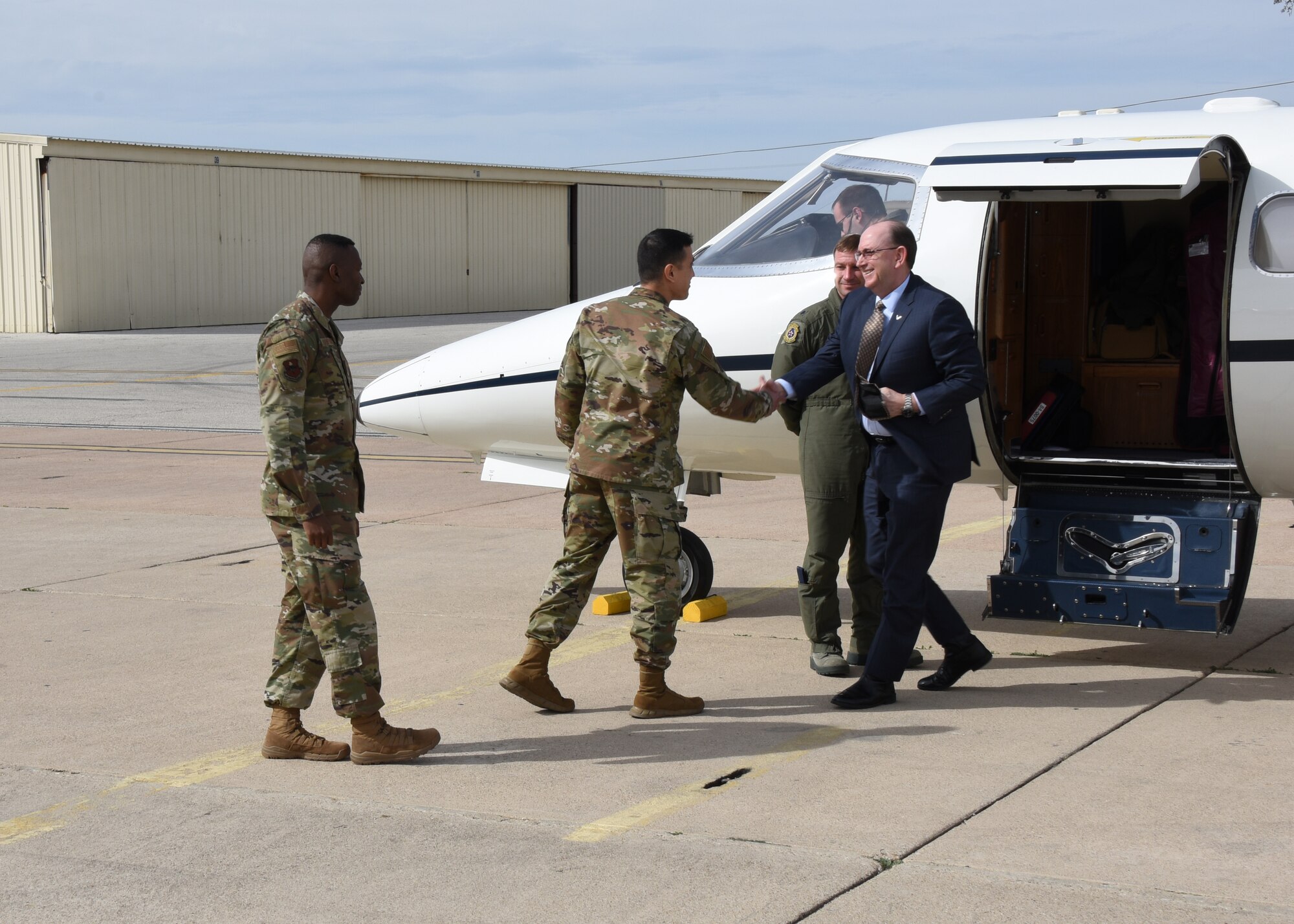 U.S. Air Force Col. Ricky Mills, 17th Training Wing commander, greets Under Secretary of the Air Force Matthew P. Donovan at Goodfellow Air Force Base, Texas, Feb. 13, 2019. Goodfellow was the first stop on Donovan’s tour of Air Education Training Command bases to see how they build a lethal and ready force through innovation and training. (U.S. Air Force photo by Airman 1st Class Zachary Chapman/Released)