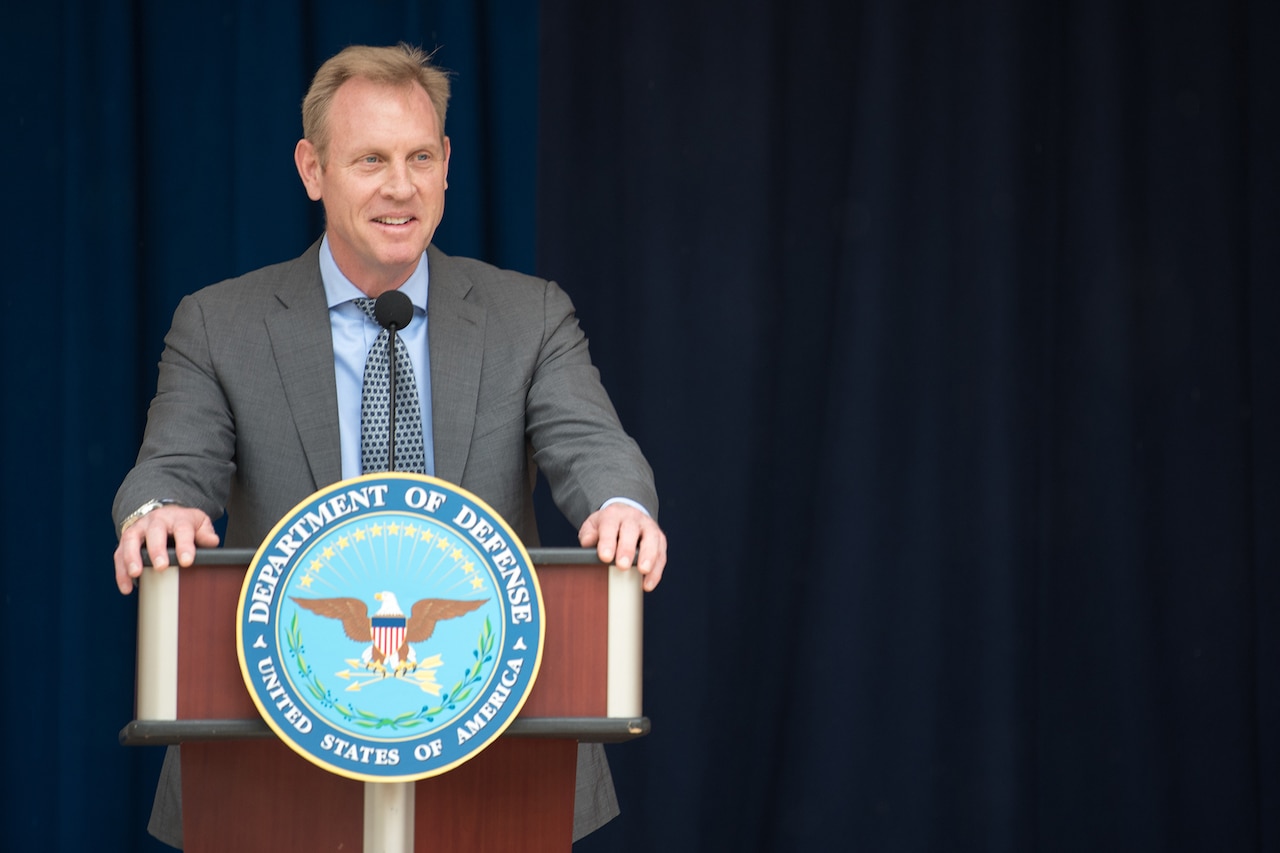 Patrick M. Shanahan stands and speaks at a lectern.